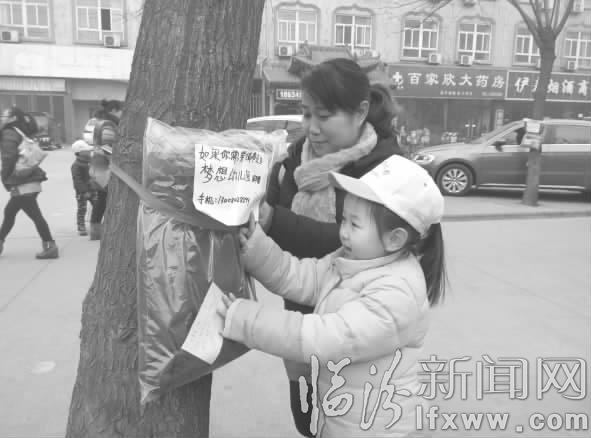 堯都區:電線桿掛棉衣 暖了身子捂熱了心